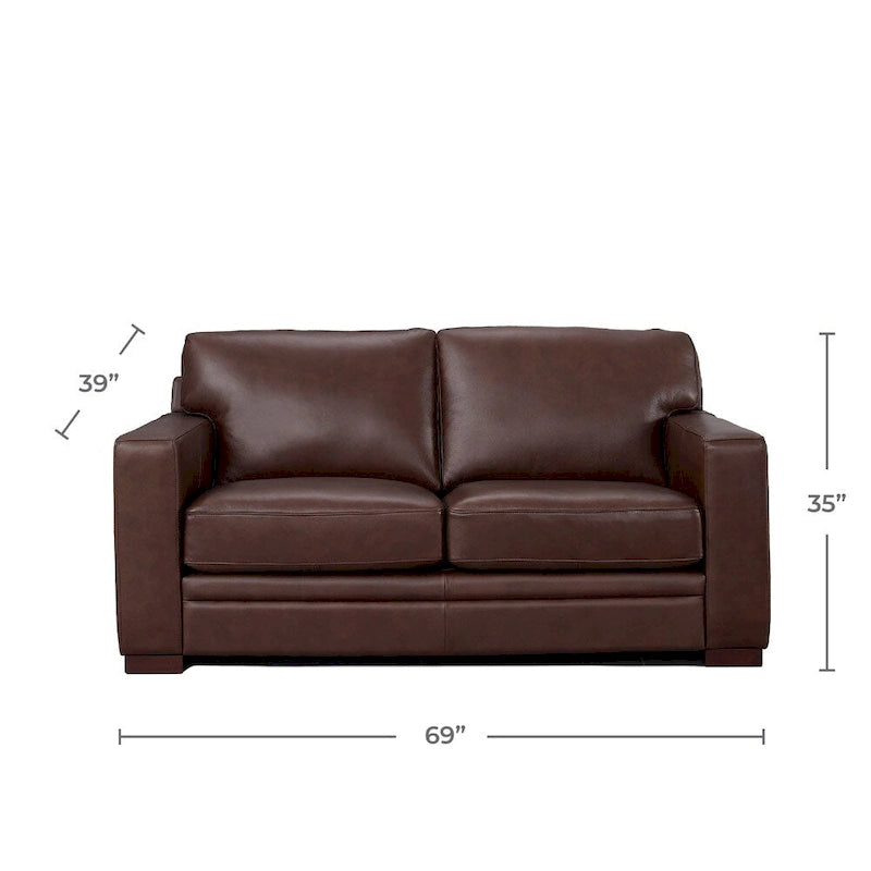 Ce canapé deux places est fabriqué en cuir de vachette pleine fleur et garni de duvet, de mousse à mémoire de forme et de ressorts.
